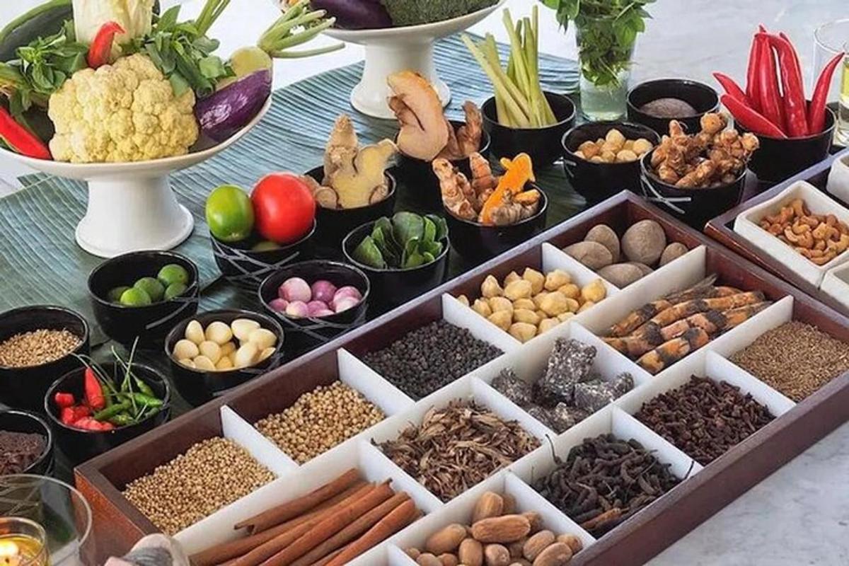 a table topped with bowls of different types of vegetables