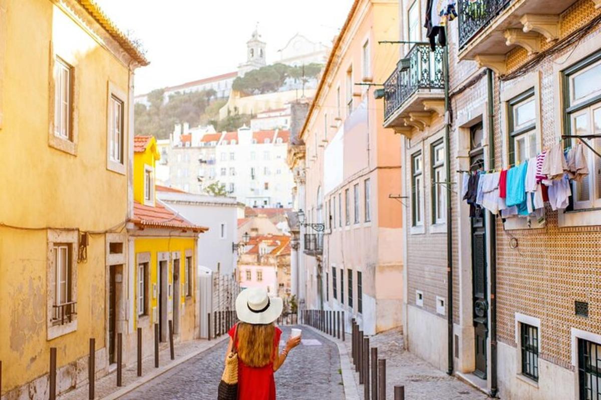 a woman in a hat walking down a street