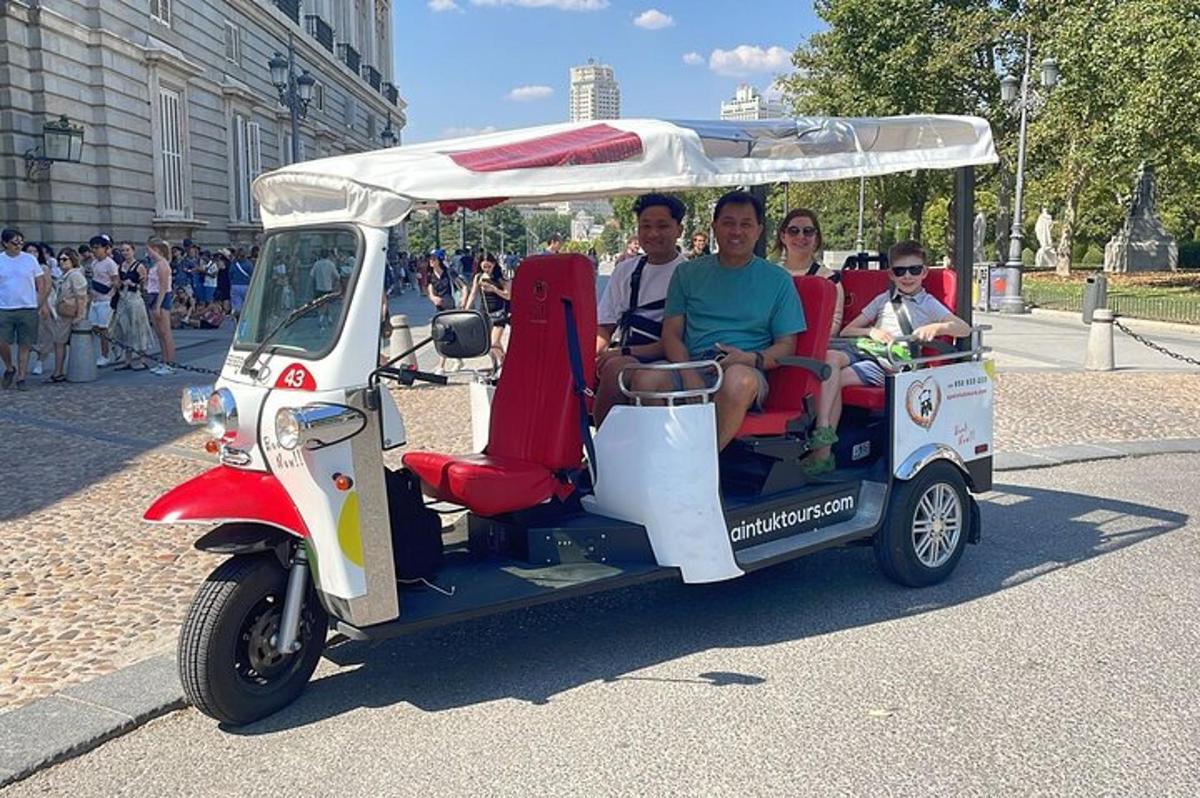 a group of people riding a golf cart