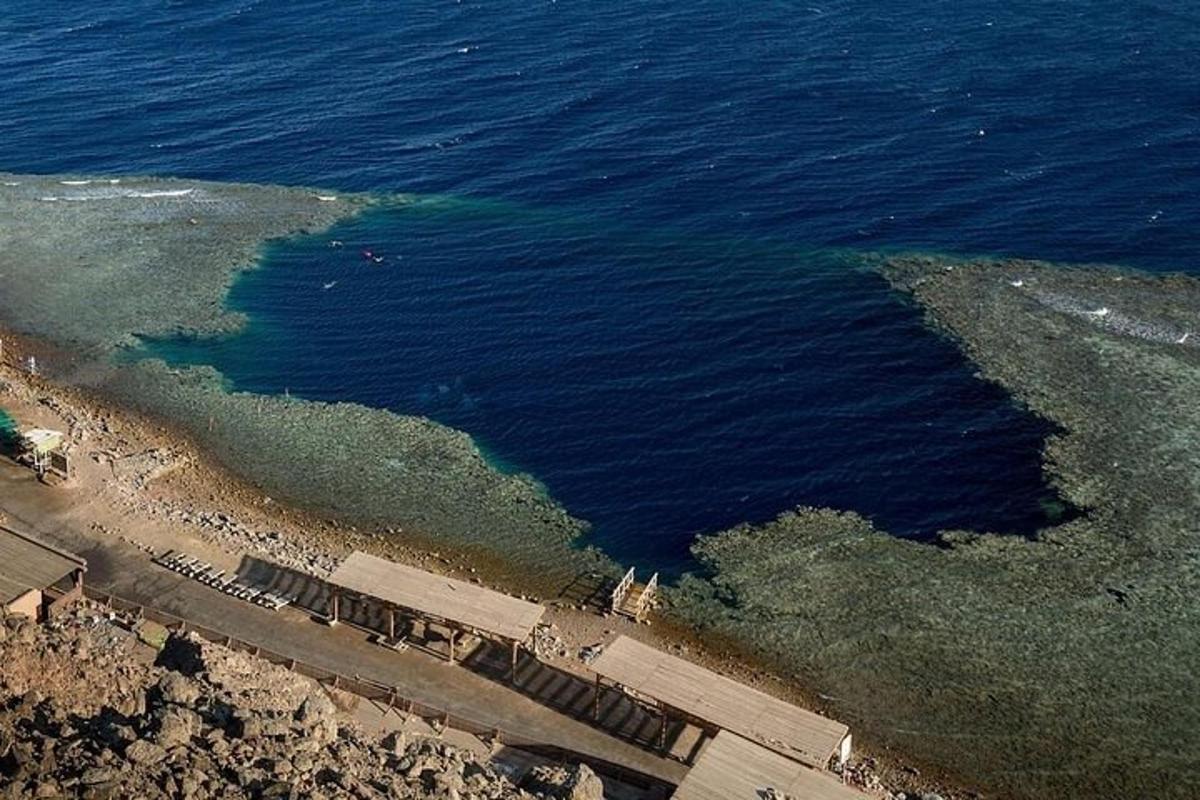 an aerial view of the ocean and a beach