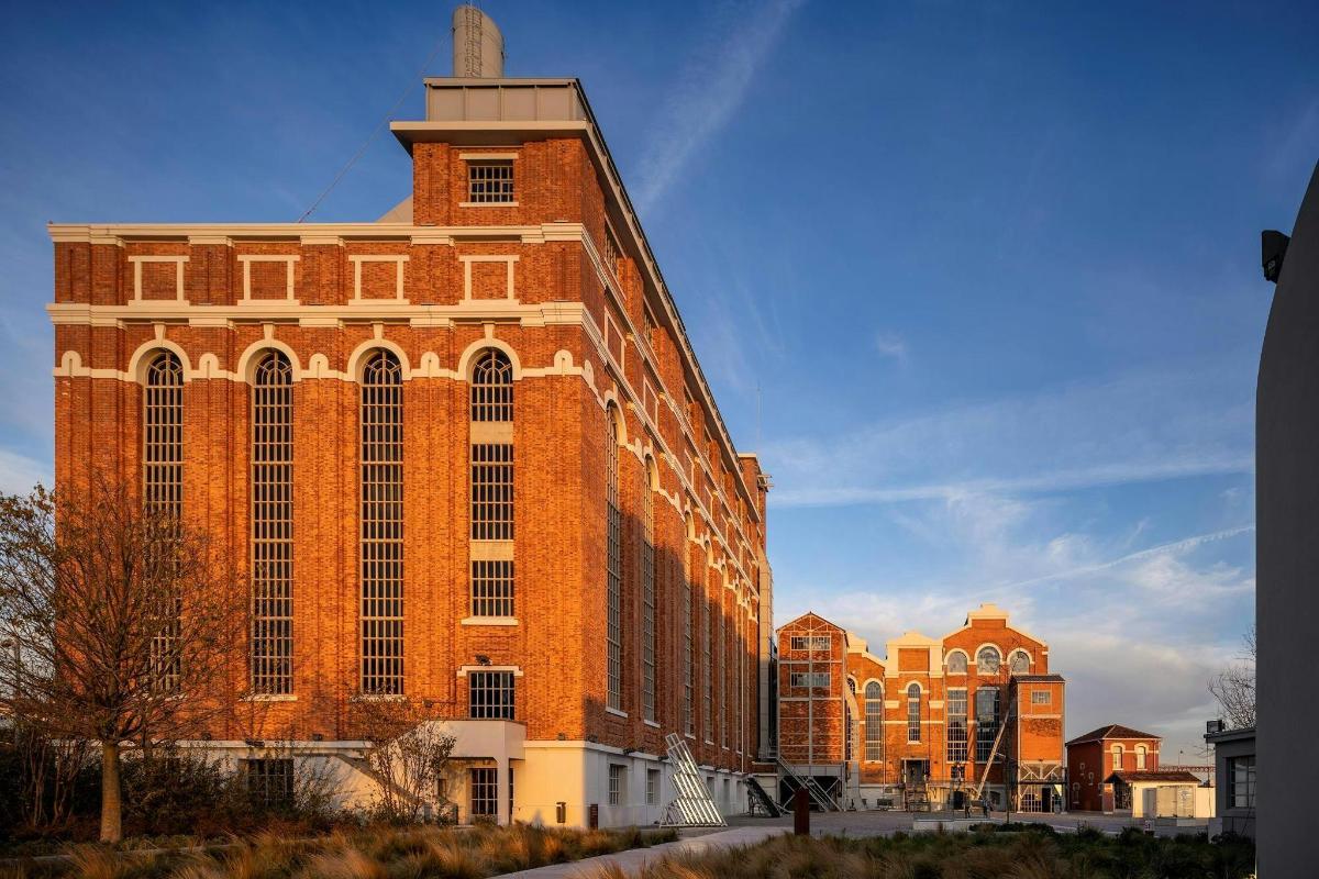 a large brick building with a tower on top of it