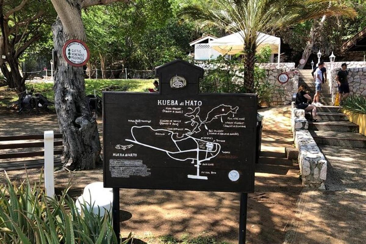 a sign in a park with a map on it