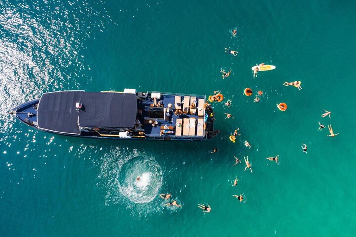 a group of people on a boat in the water