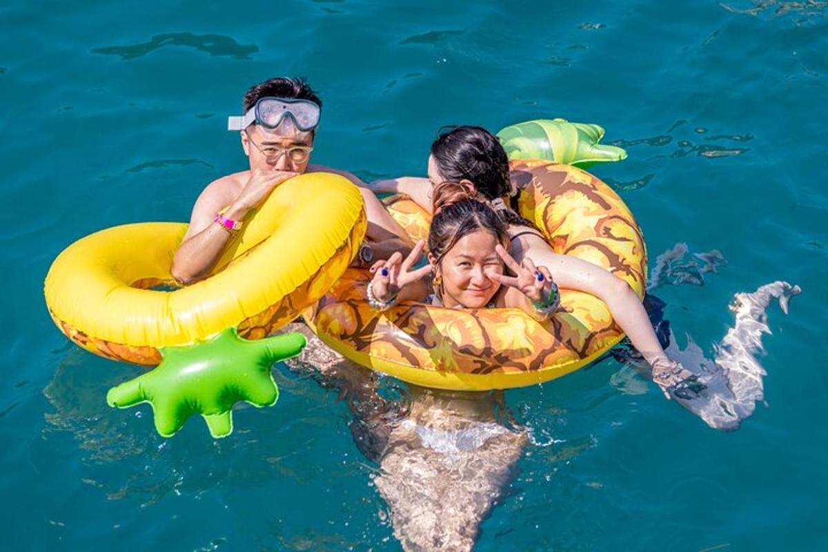 a group of people in the water in inflatables