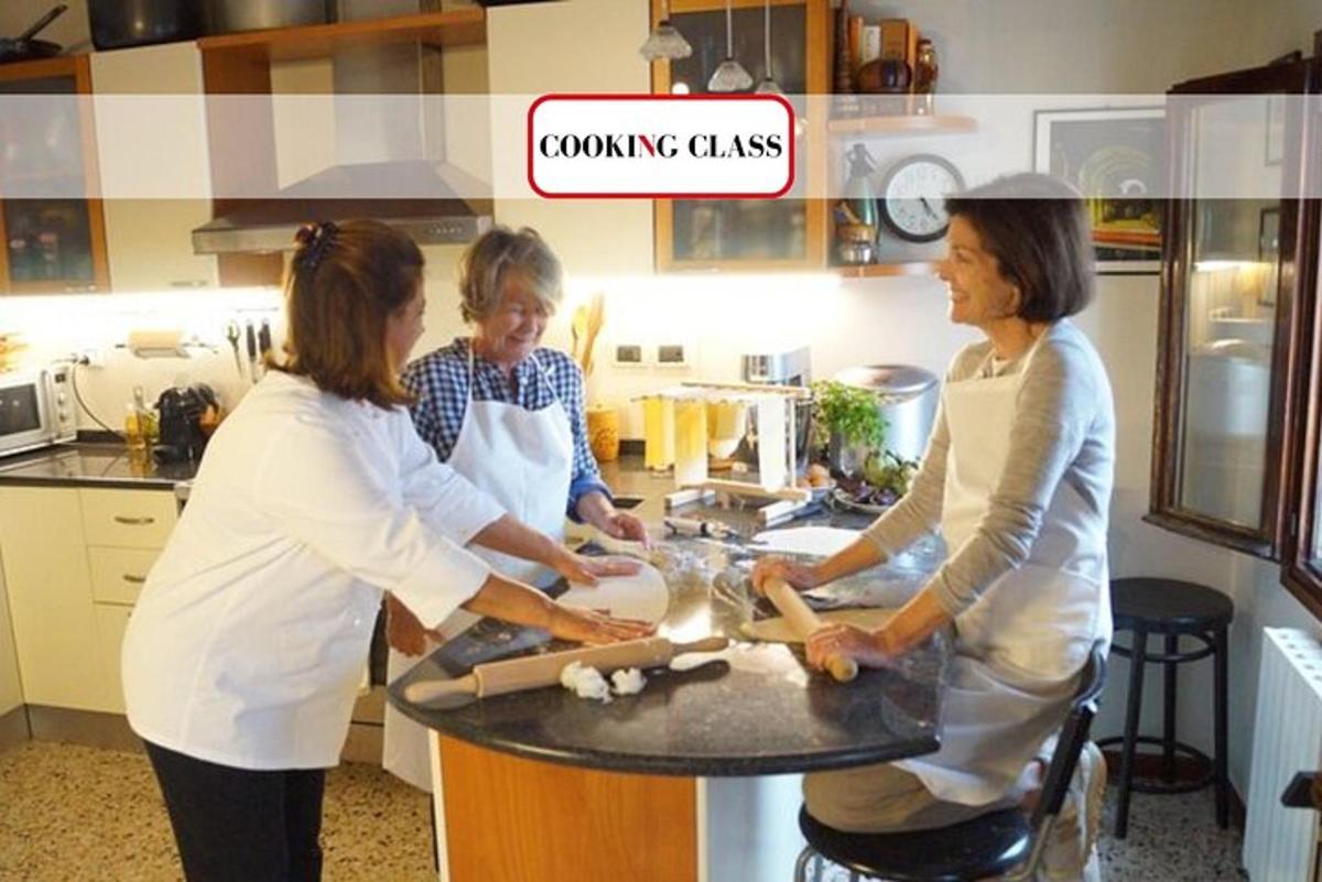 three women standing in a kitchen preparing food
