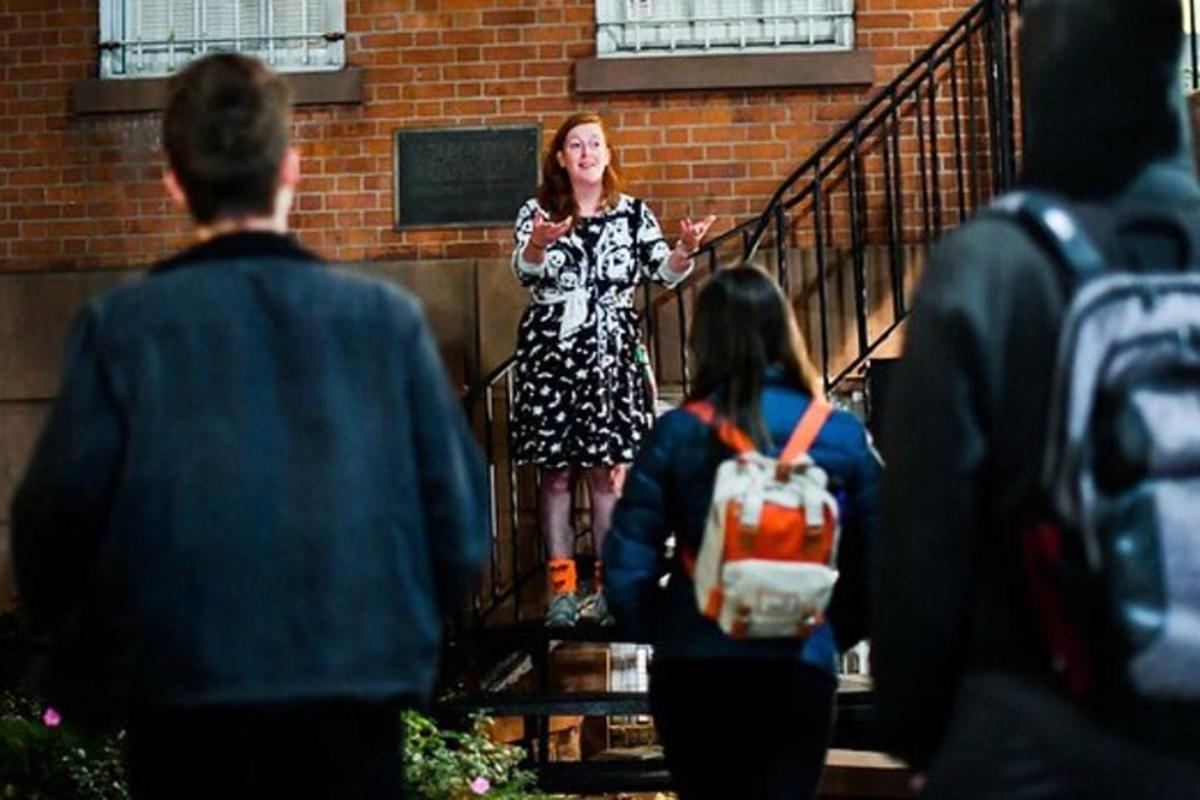 a woman is walking down the stairs