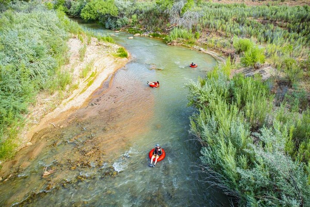 a group of people in kayaks in a river