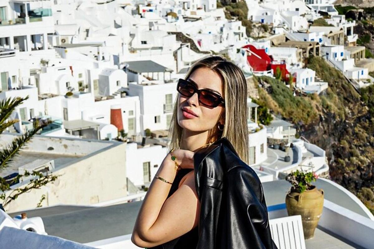 a woman wearing sunglasses and a leather jacket