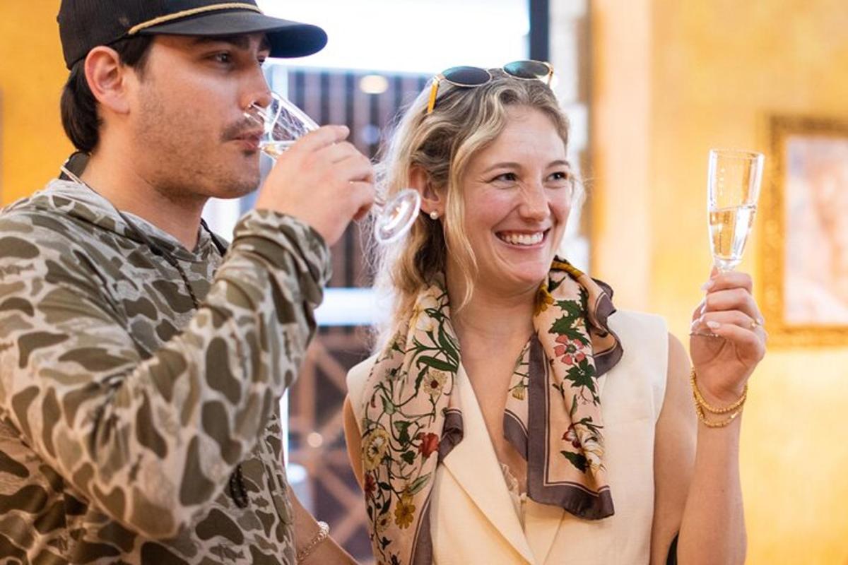 a man and a woman holding champagne glasses