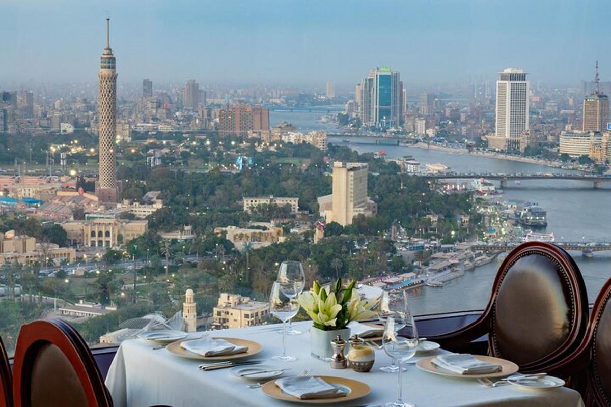 a table with chairs and a view of a city