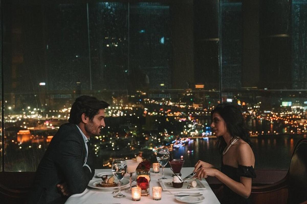 a man and a woman sitting at a table in a restaurant