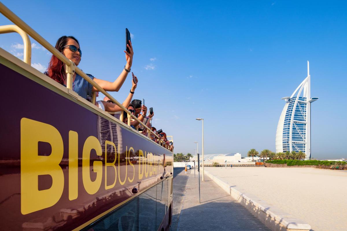 a group of people riding on a double decker bus