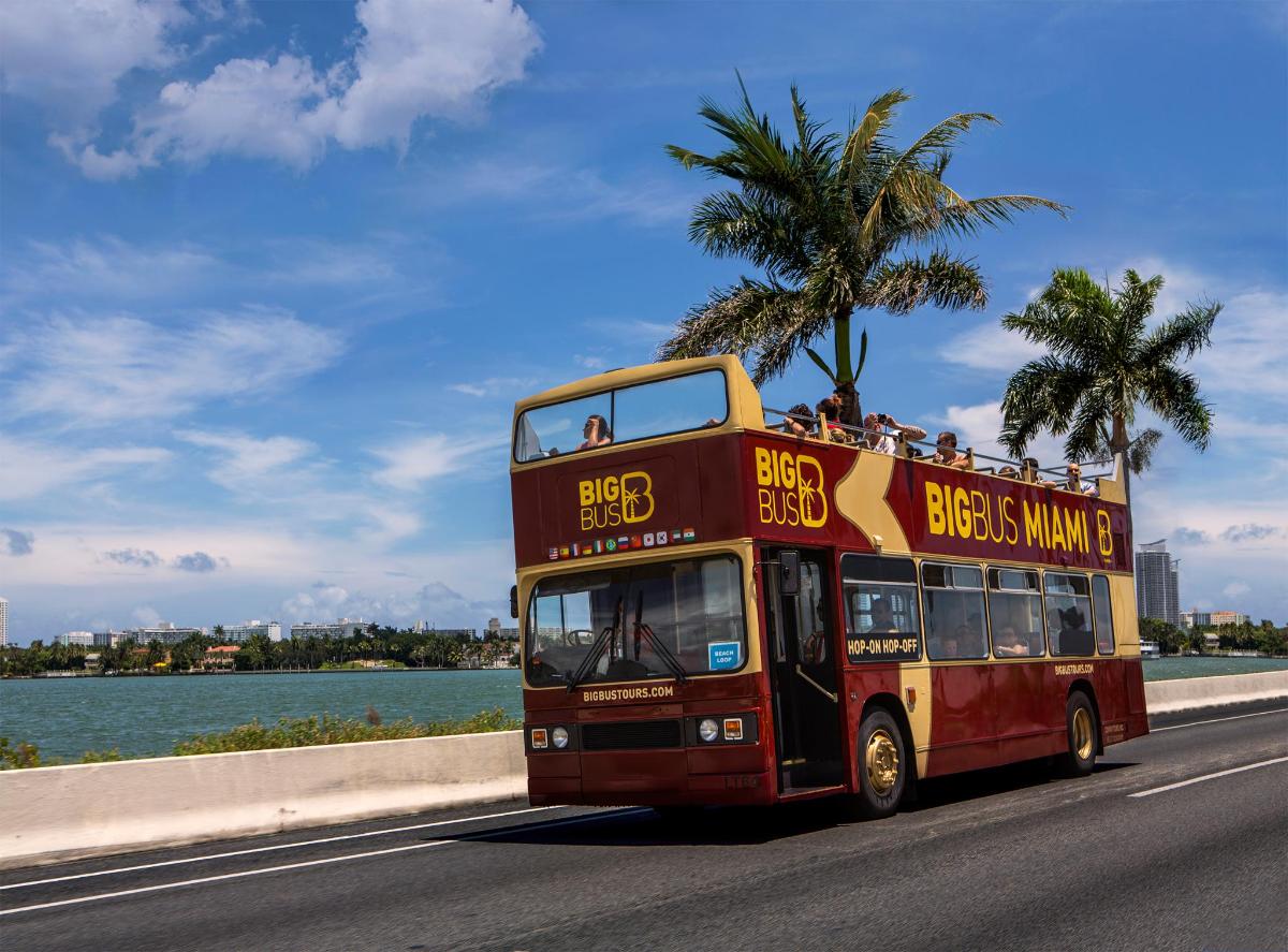 a double decker bus driving down a road