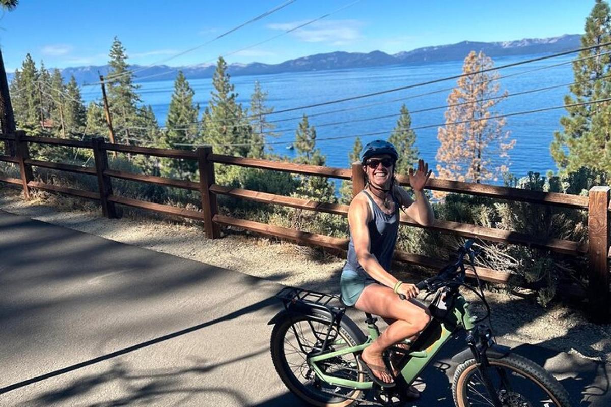 a woman is riding a bike on a bridge