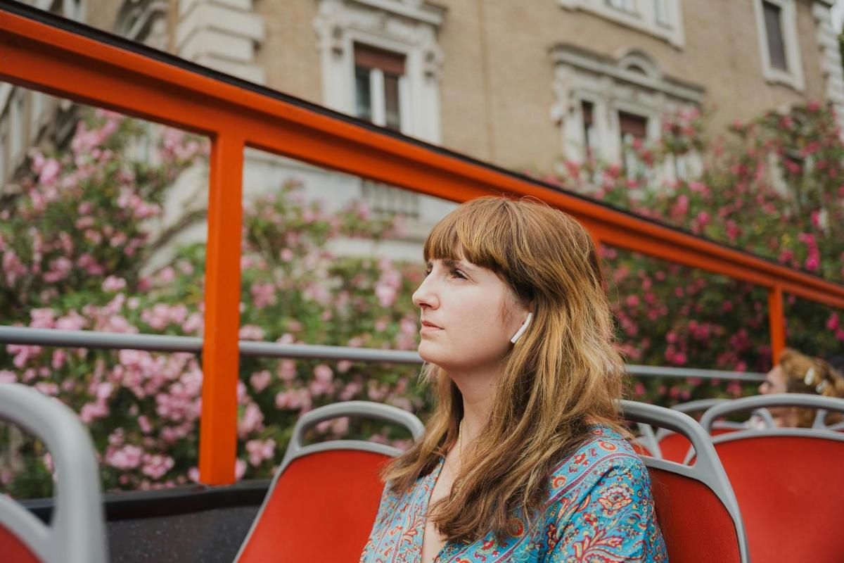 a woman sitting in a chair on a bus