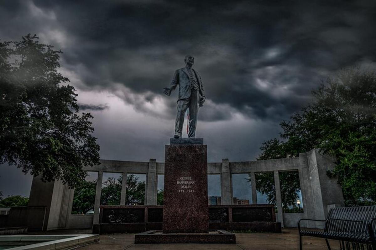 a statue of a man on top of a monument