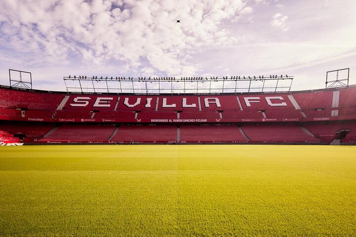 a baseball field with a red stadium with a field