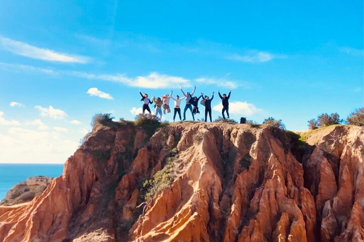 a group of people standing on top of a mountain
