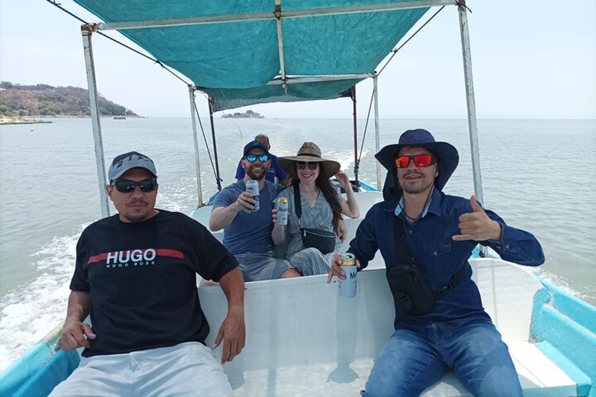 a group of people sitting in the back of a boat