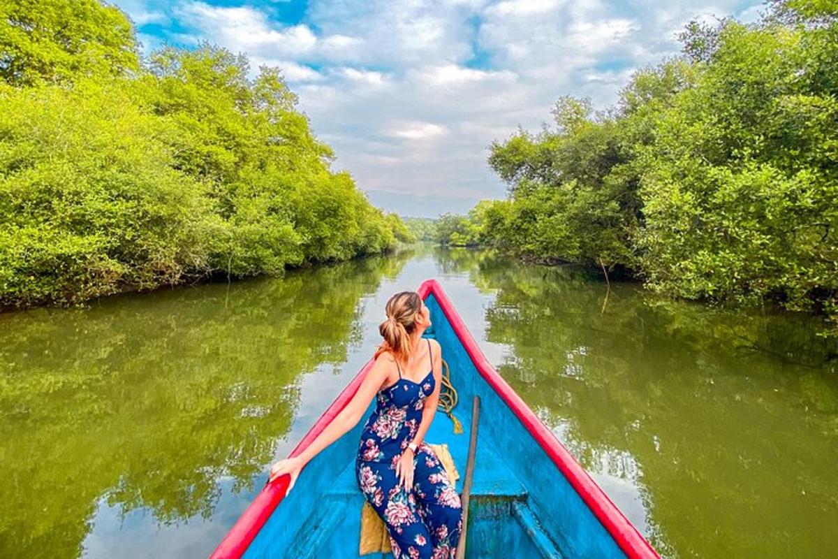 a woman in a dress on a boat on a river