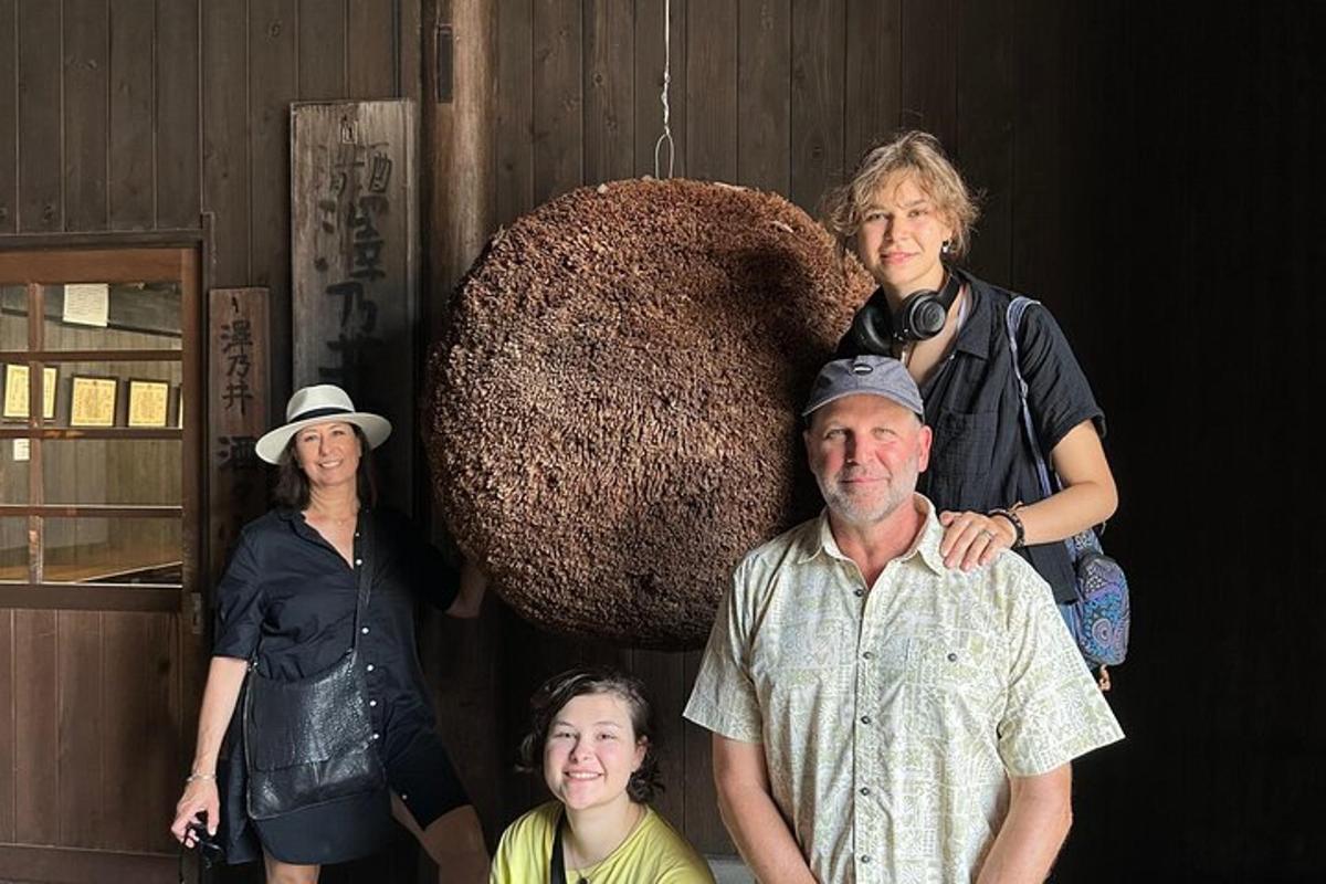 a group of people standing in front of a large object