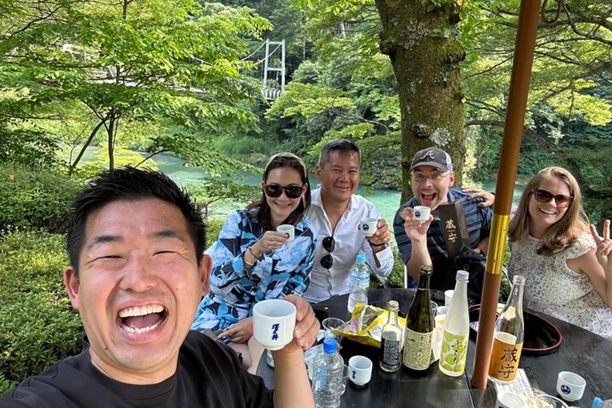 a group of people sitting at a table with their drinks
