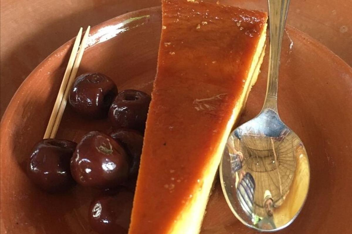 a plate of food with a spoon and a dessert