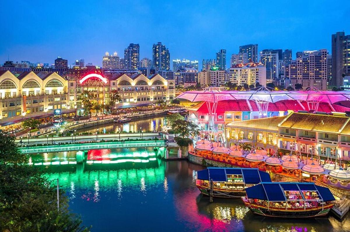 a city at night with boats in the water