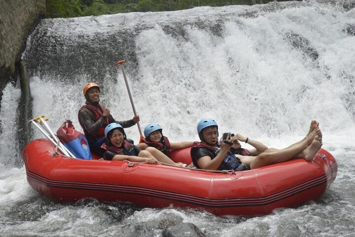 a group of people in a raft in a waterfall