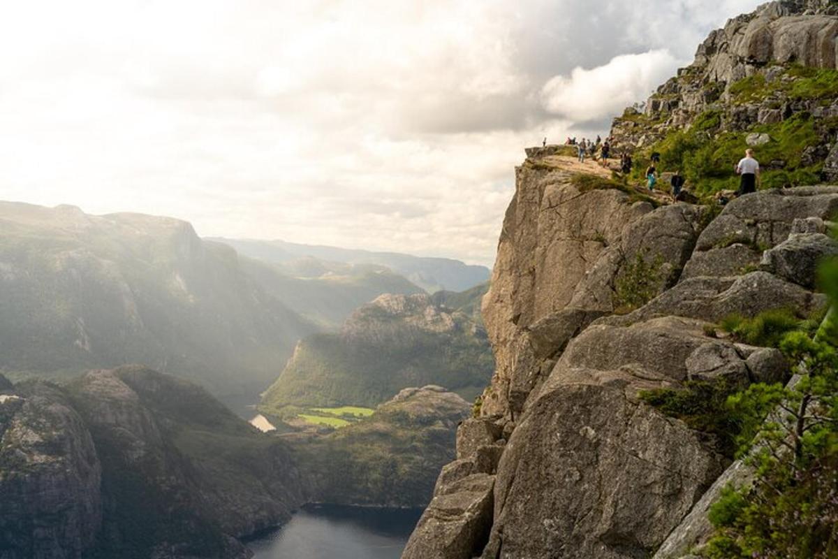 a group of people standing on top of a mountain