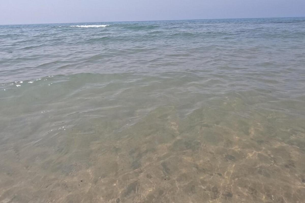a large body of water with rocks in it