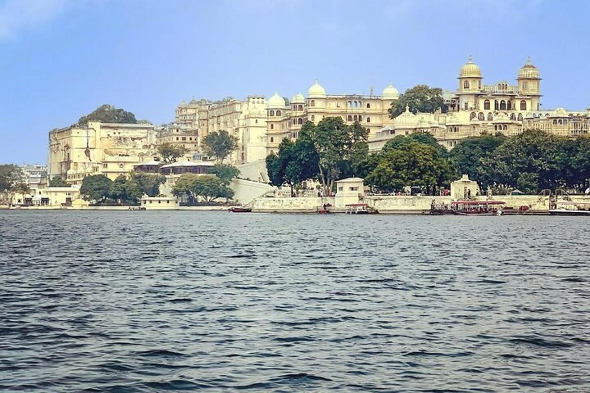 a large body of water with buildings in the background