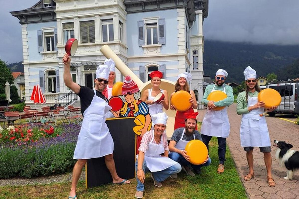 a group of people dressed in chefs posing in front of a house