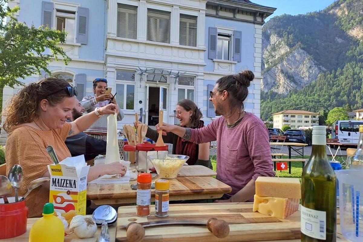 a group of people sitting at a table with food