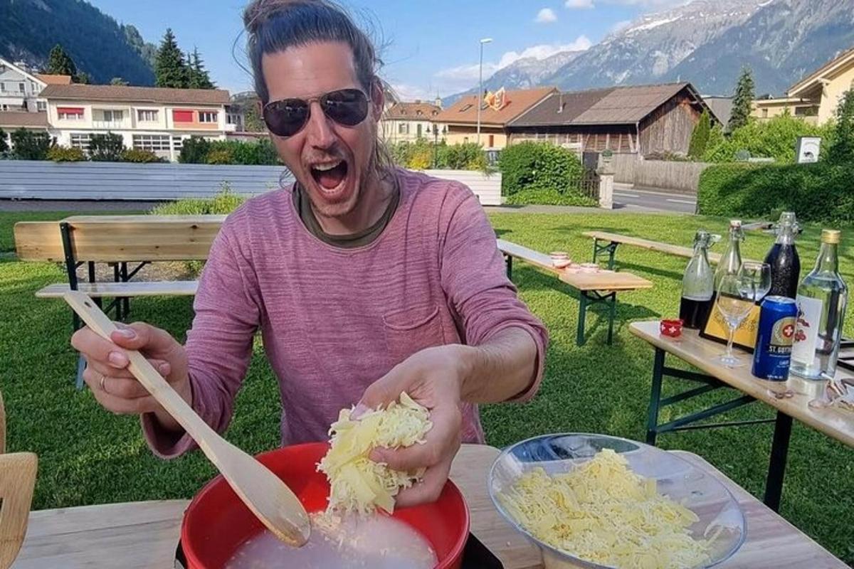 a man is preparing food in a bowl on a table