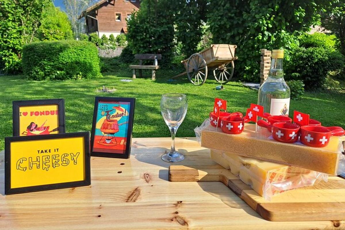 a picnic table with a bottle of wine and cheese