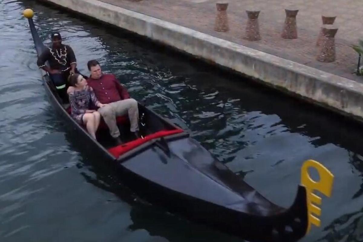 a group of people in a boat in the water