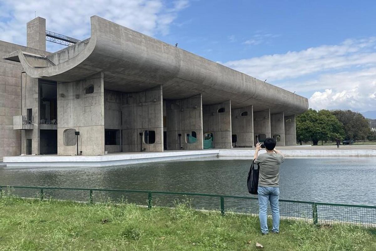 a woman taking a picture of a building