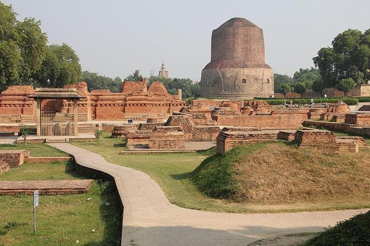 a large building with a monument in the background