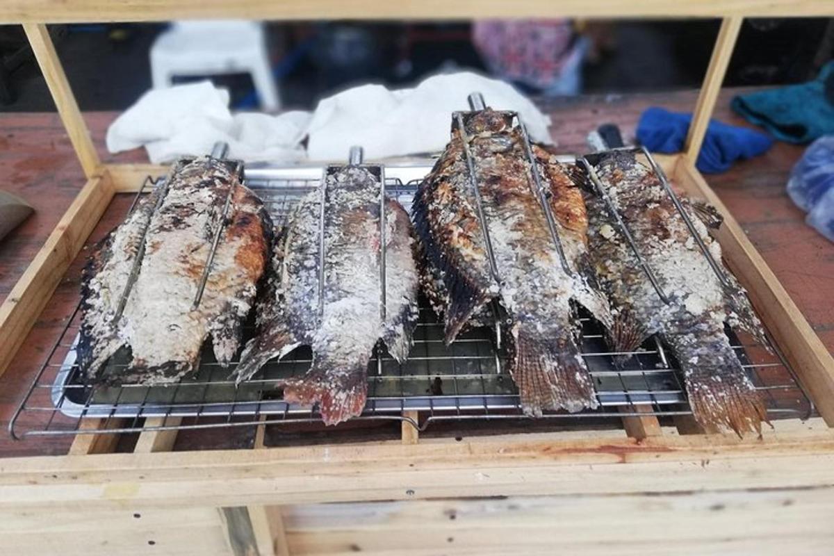 a group of fish on a grill on a table