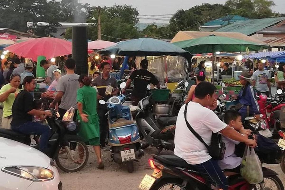a group of people on motor bikes and umbrellas