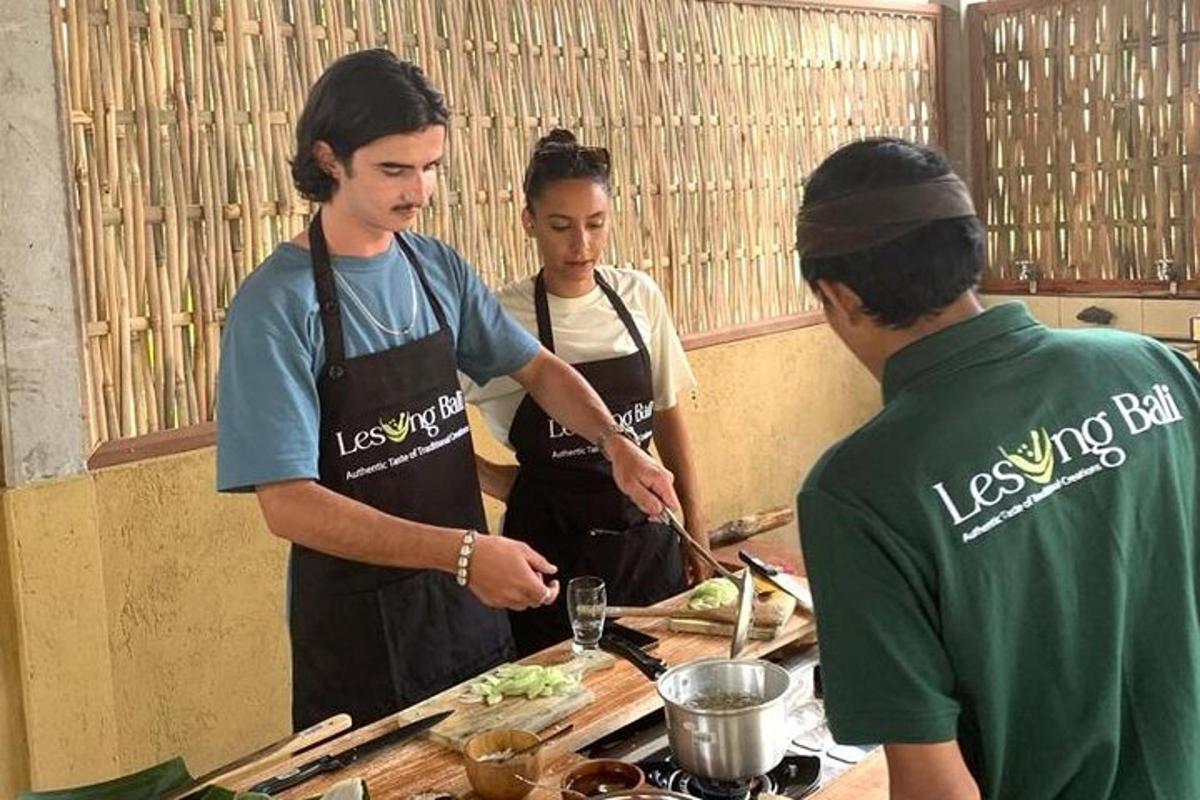 a group of people in a kitchen preparing food