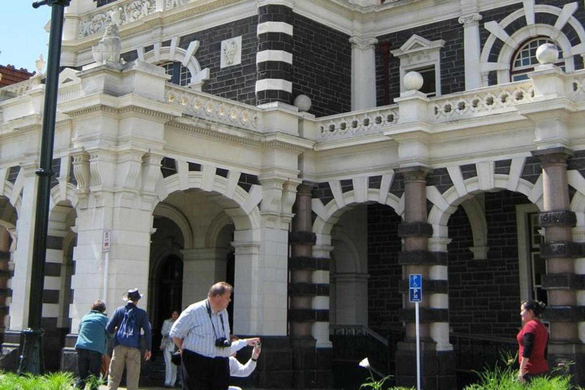 a man standing in front of a building