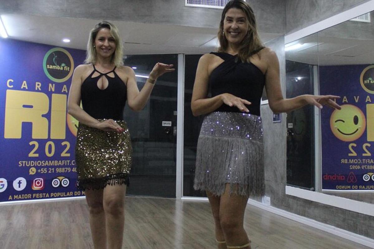 two women are standing on a dance floor