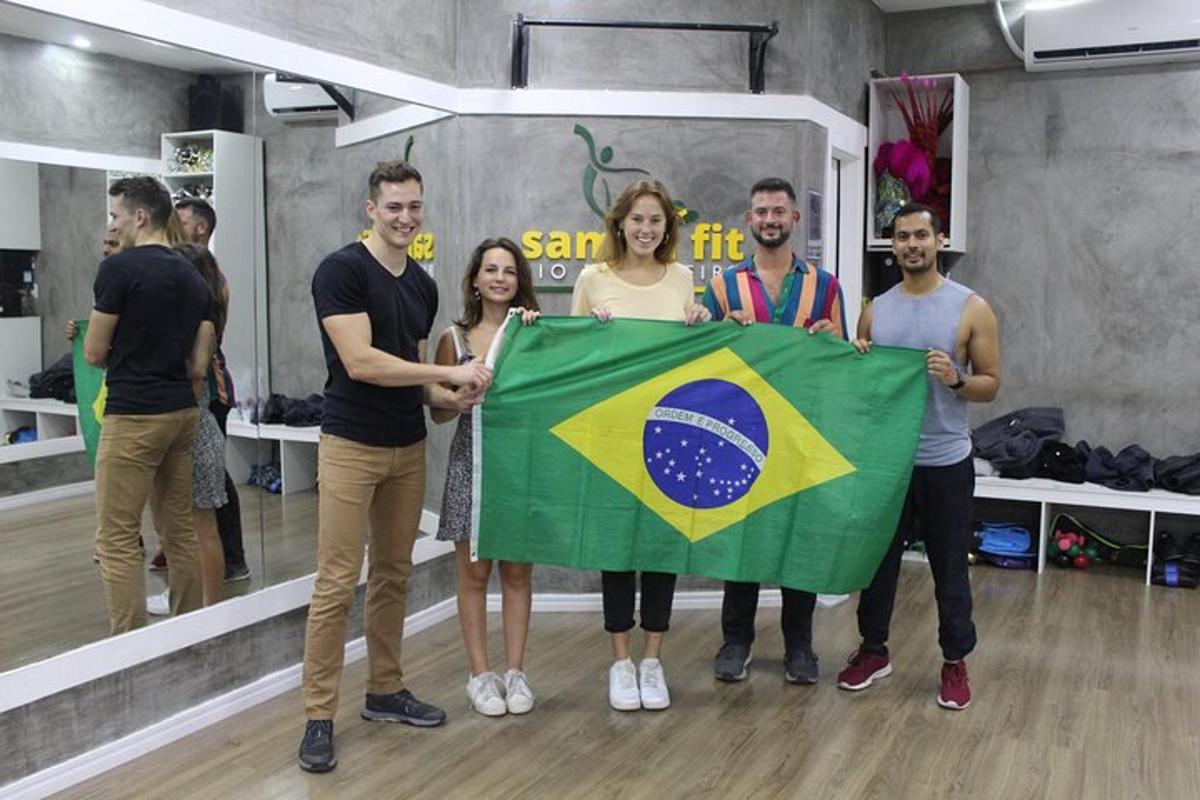 a group of people holding a brazilian flag