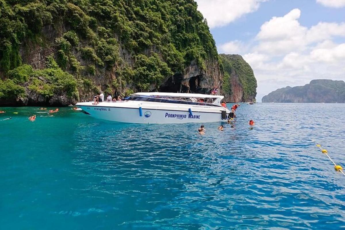 a boat in the water with people in the water