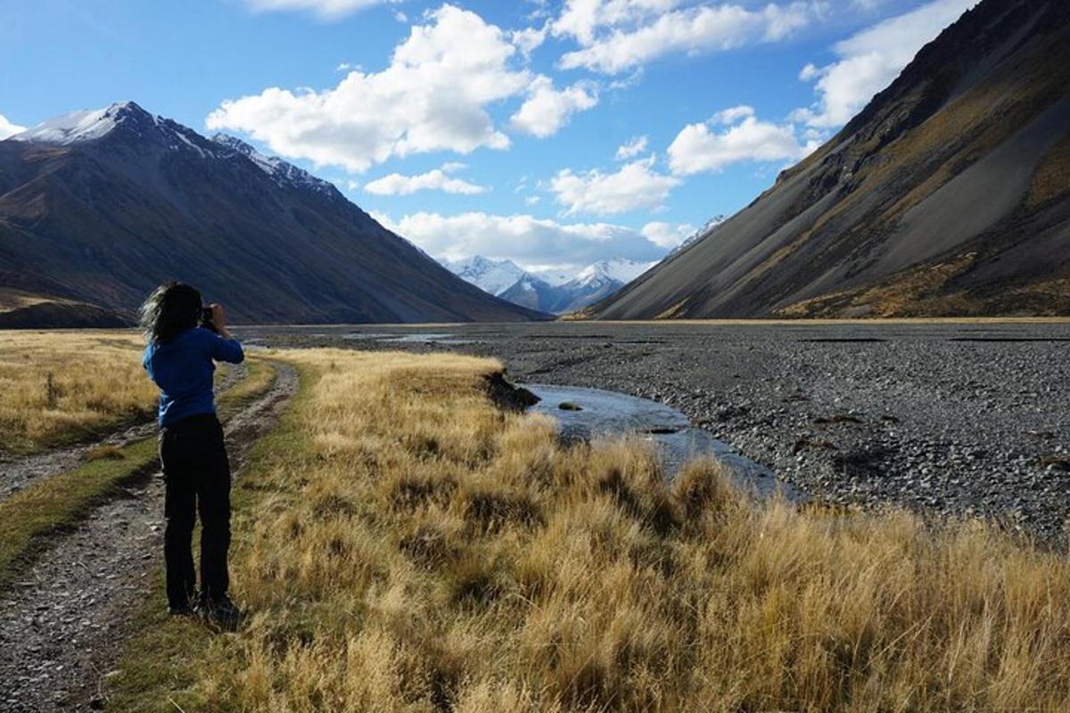 a person taking a picture of a mountain