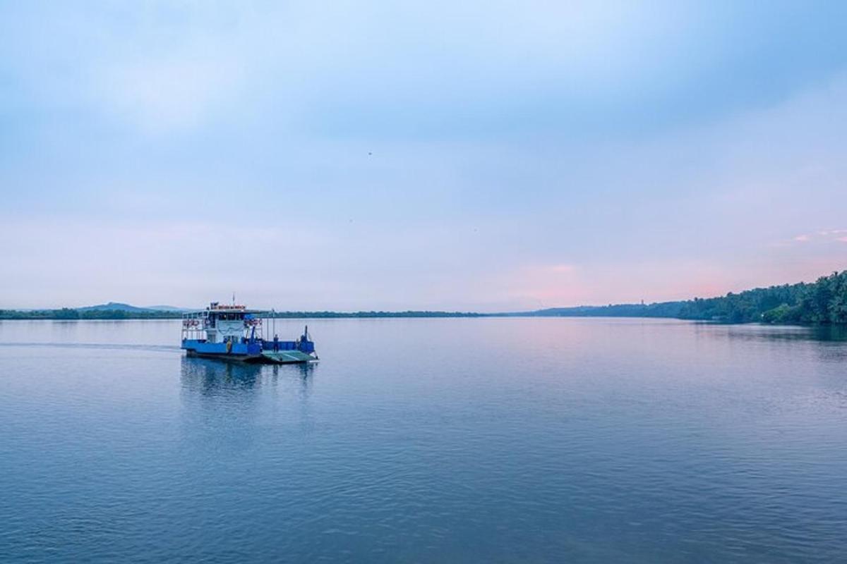 a blue boat on a large body of water