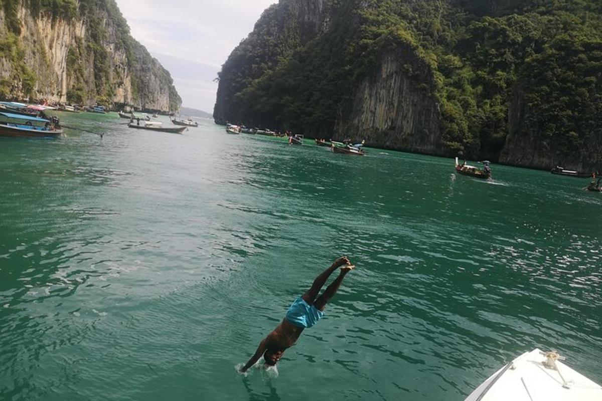 a man is in the water on a boat