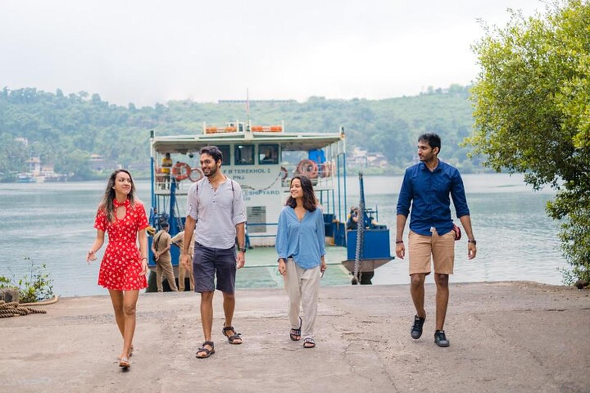 a group of people walking on a dock with a boat